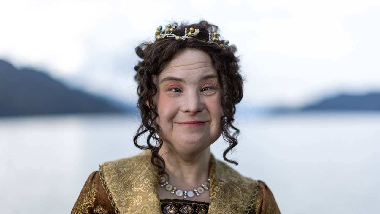 a woman with a crown smiling